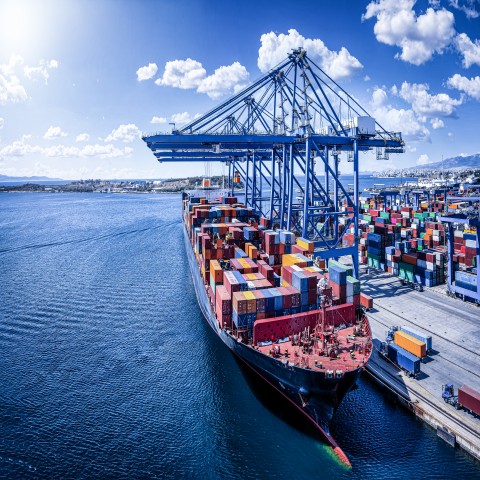 Container ship loaded with shipping containers at a cargo port