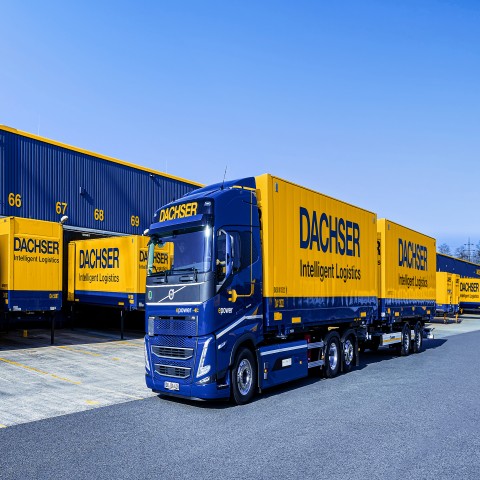 DACHSER trucks and trailers at a logistics facility